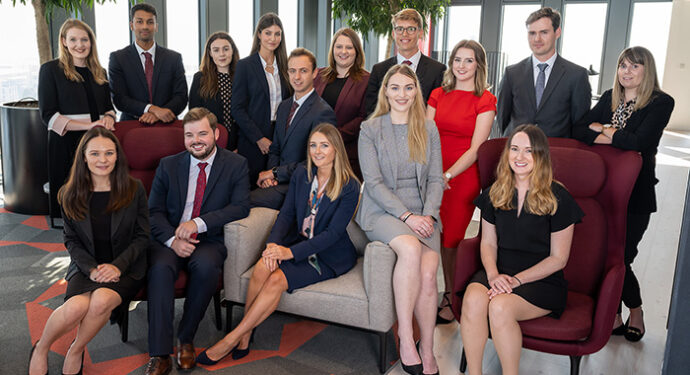 a group of trainees from our summer placement scheme gathered in the vista lounge of Hugh James' 2 Central Square Cardiff office