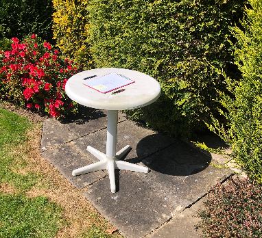 white table in garden with will and two pens | Hugh James white table in garden with will and two pens | Hugh James