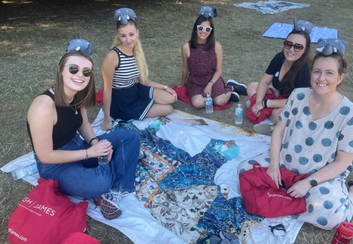Members of the Clinical Negligence and Serious Injury teams relax on a picnic blanket in Bute Park