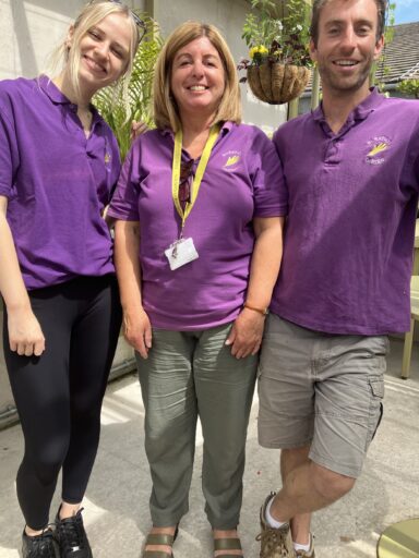 Paralegal Madeline Lloyd in the Serious Injury Team with the gardeners at Horatio's Garden Wales