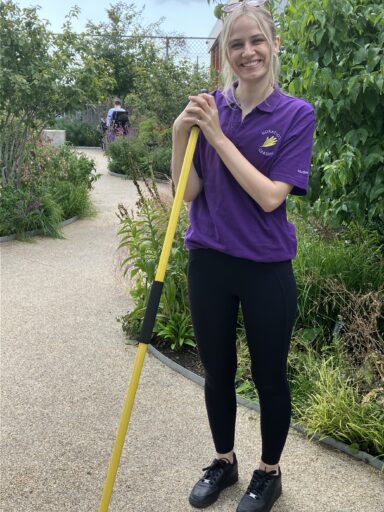 Paralegal Madeline Lloyd in the Serious Injury Team volunteering at Horatio's Garden Wales.