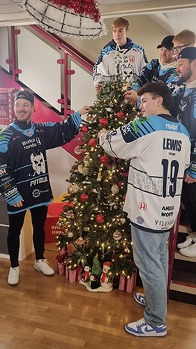 Members of the Bristol Pitbulls ice hockey team give a helping hand decorating for Decorate for December at Ronald McDonald House Bristol