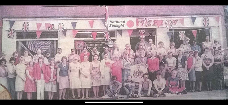 A photograph of the laundry factory in Birmingham with the employees stood outside. Mr Ward appears in the centre of the photograph and has been circled.