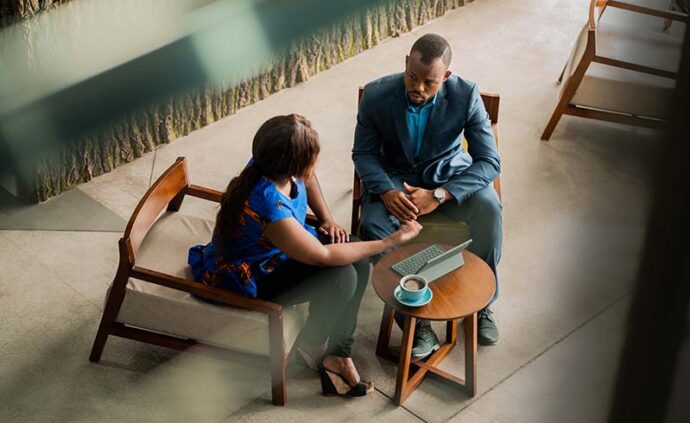Wide shot business meeting consultation by a financial adviser.