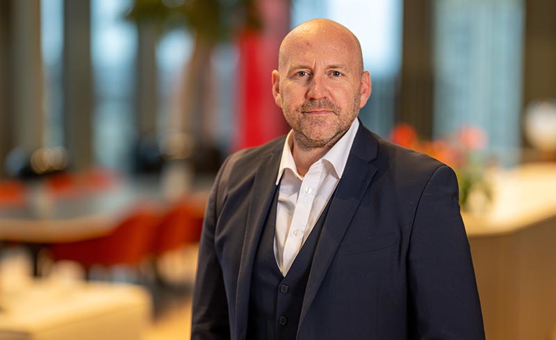 A headshot of Jonathan Askin in Hugh James' Cardiff office
